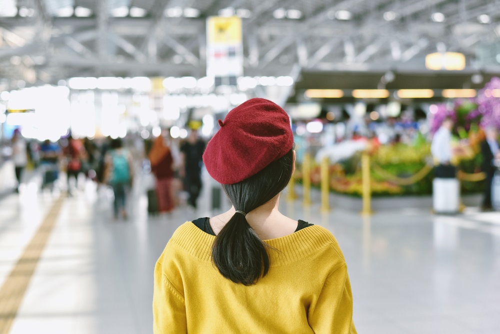 woman-standing-in-trade-show-exhibition-hall