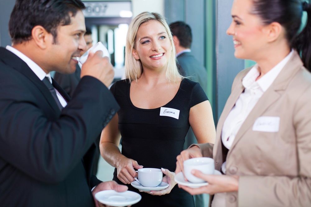 Group of business people having coffee break during seminar to expand your network.