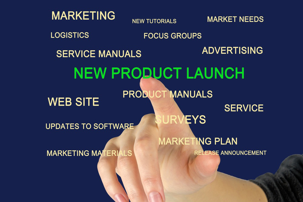 A-blue-background-with-multiple-words-of marketing-tools-and-a-finger-pointied-to-the-words-Product-Launch.