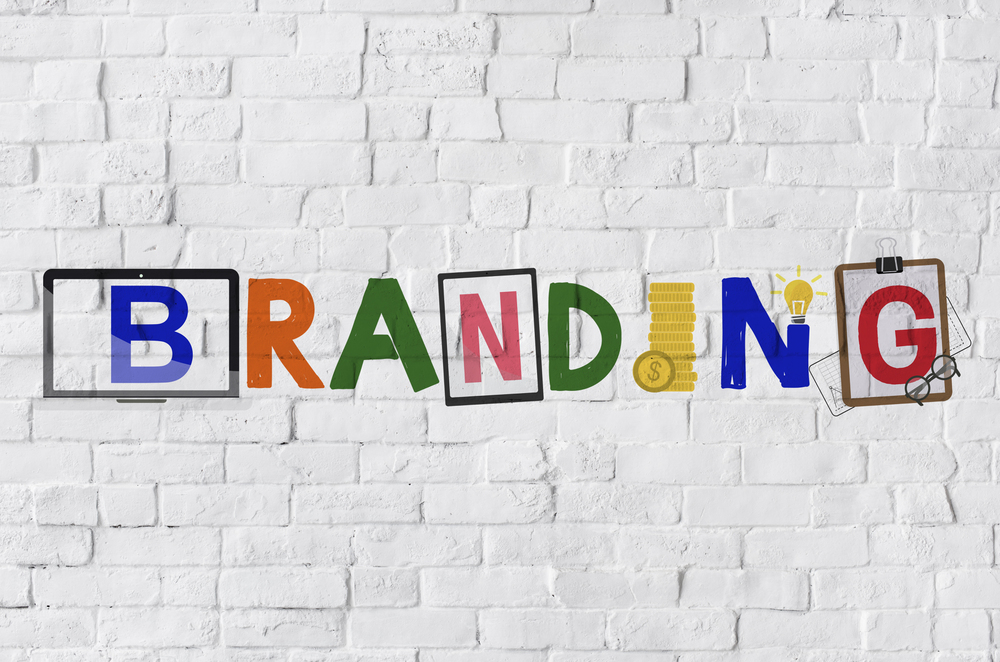 The word BRANDING on a white brick background, representing the importance of brand values.