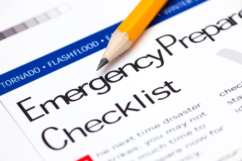 Pencil on brochure with the text Emergency Preparedness Checklist