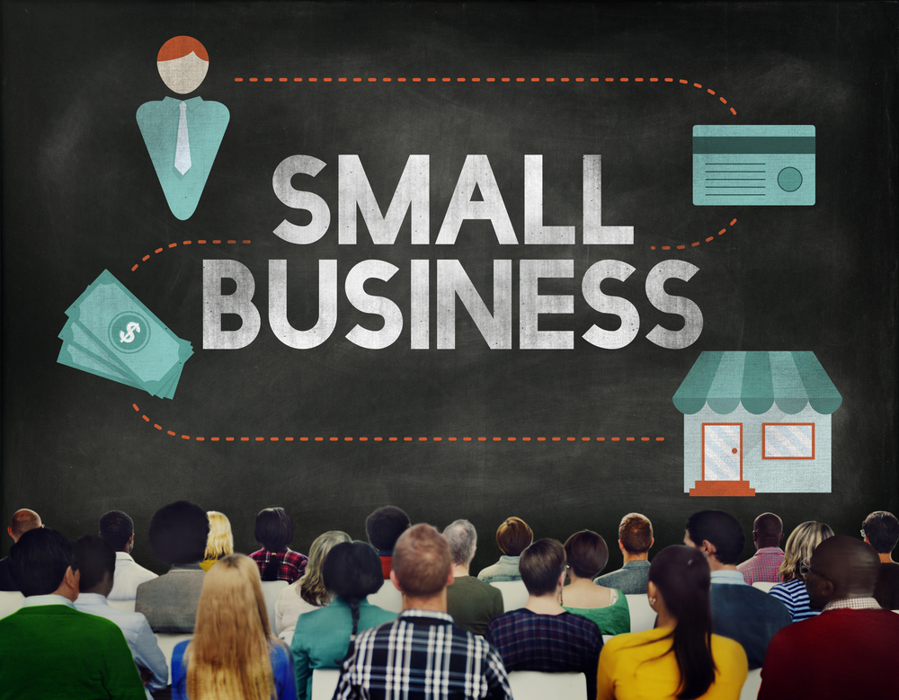 artistic rendering of a group of small business owners in an audience looking at a projector screen with Small Business